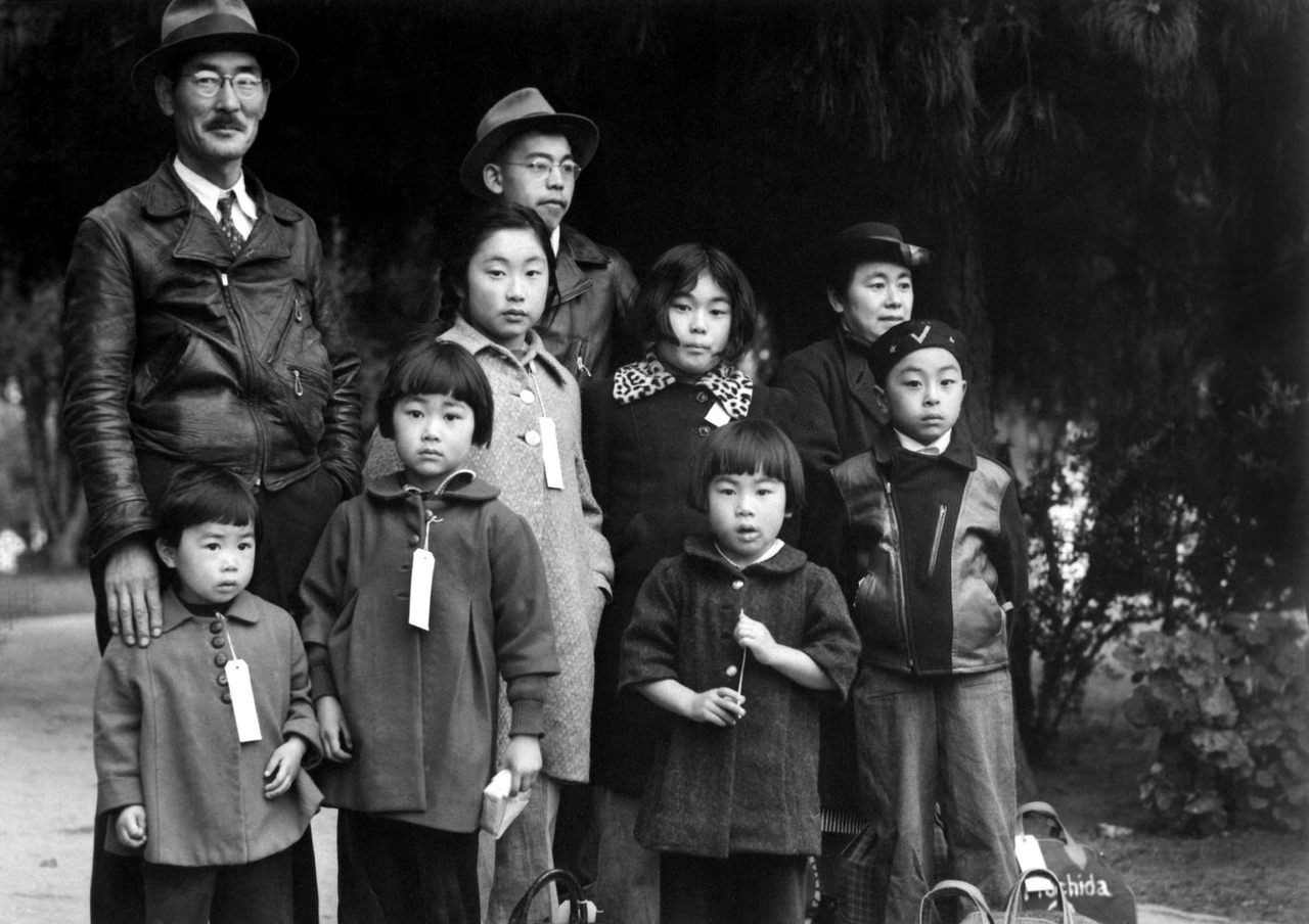 After the attack on Pearl Harbor, President Franklin D. Roosevelt issued an executive order relocating Japanese Americans because he deemed them "a threat to national security." Here, members of the Mochida family wear identification tags while waiting to be transported to an internment camp.