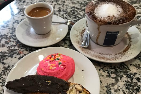 Espresso, cocoa topped cappuccino, cookie and chocolate covered biscotti. 