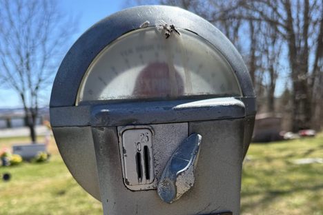Close up of Gordy and Joyce Burdick's expired parking meter gravestone