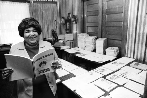 Waddles, with copies of her poetry-infused "Soul Food Cookbook."