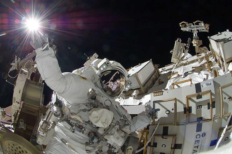 Sunita Williams, sExpedition 32 flight engineer, appears to touch the bright sun during a spacewalk conducted on 5 September 2012.