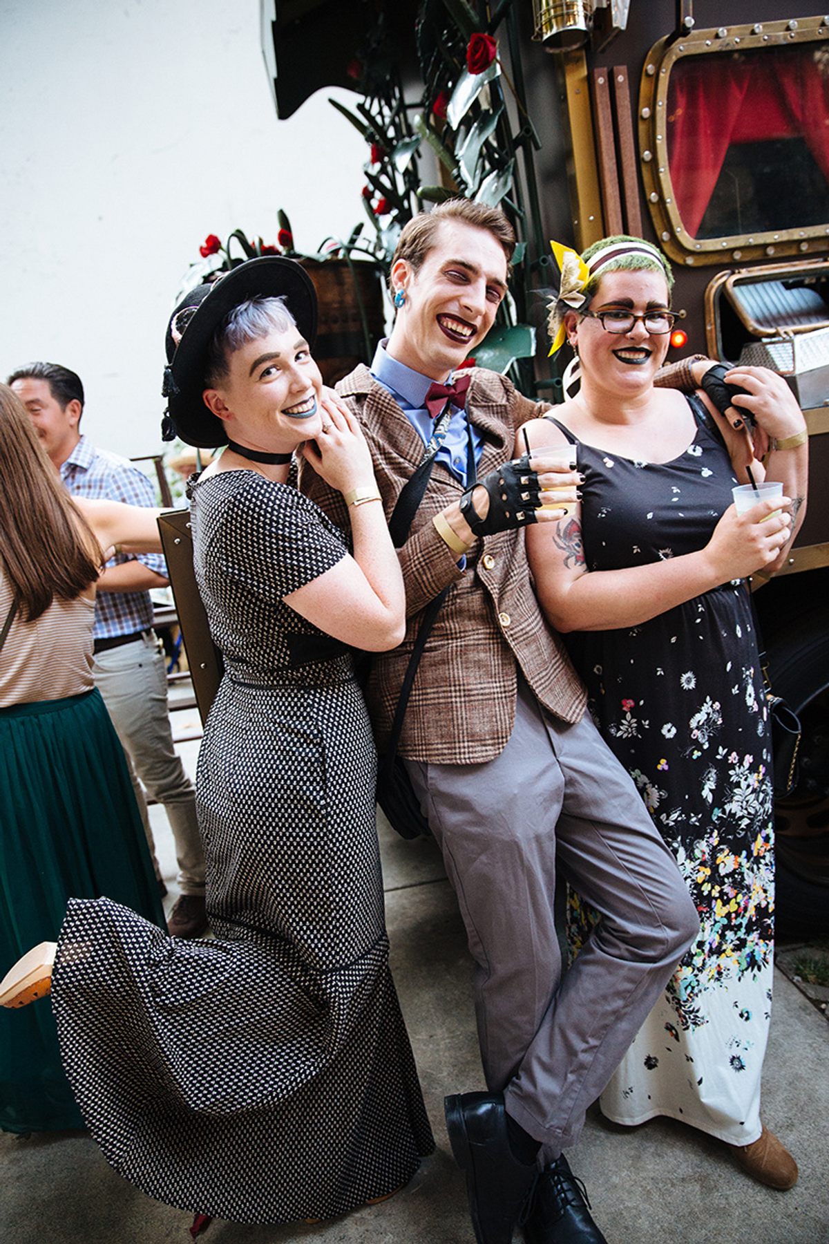 A trio of guests, lively and lipsticked.
