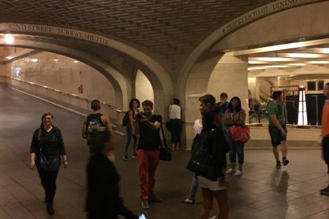 Use an acoustic anomaly to share a secret with a friend across a crowded station.