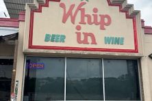 The exterior of Whip In.