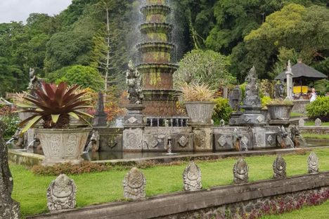 Beautiful fountain surrounded by lush gardens