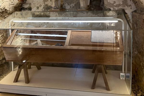 The mummified remains of the vicar are visible from his glass encased coffin.