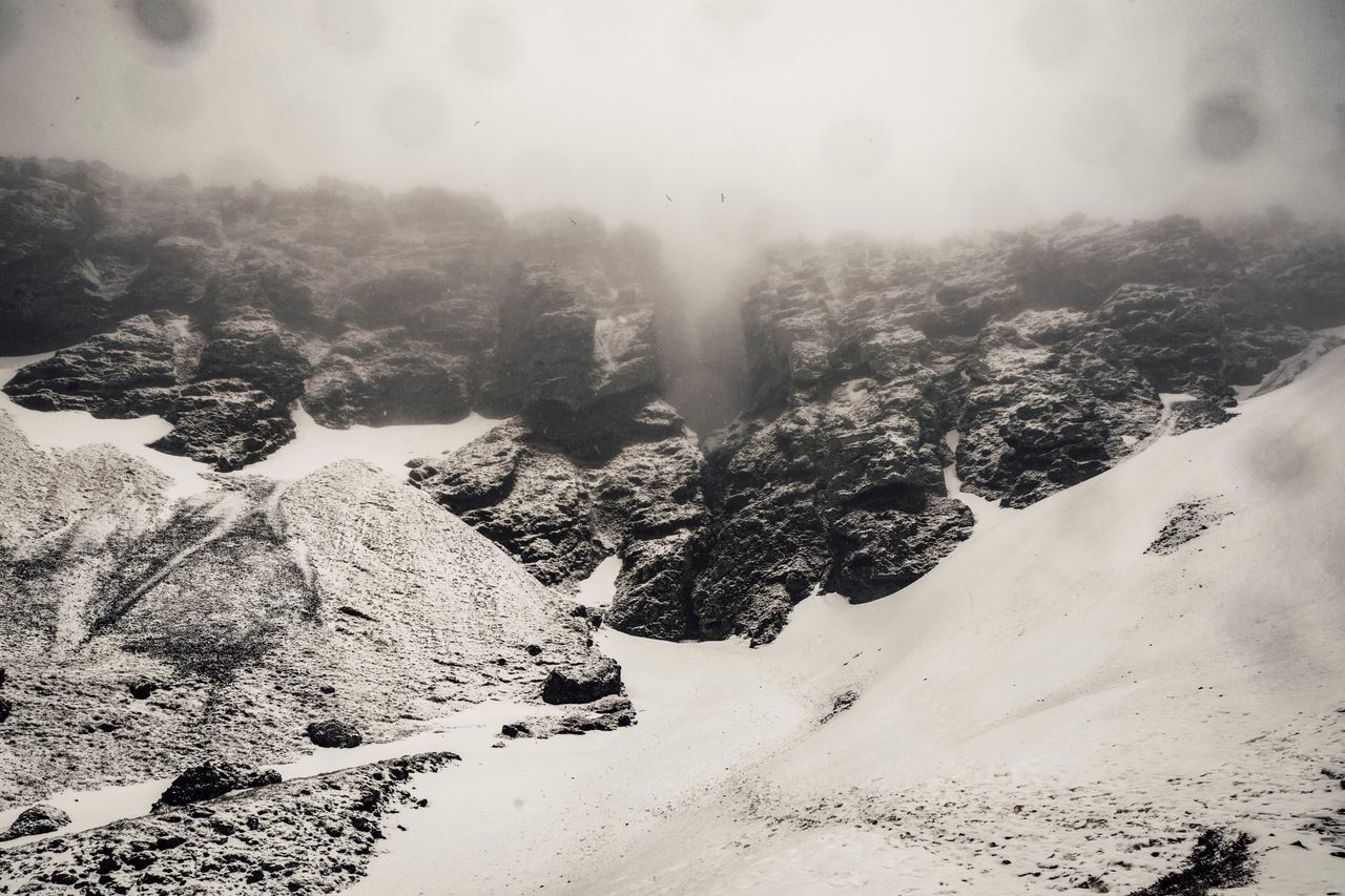 The snow-laden, misty entrance of Iceland's Rauðfeldsgjá Gorge resembles the entrance to Helheim, the realm of the dead who did not make it into Valhalla.