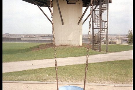 Children play among the old missile equipment.