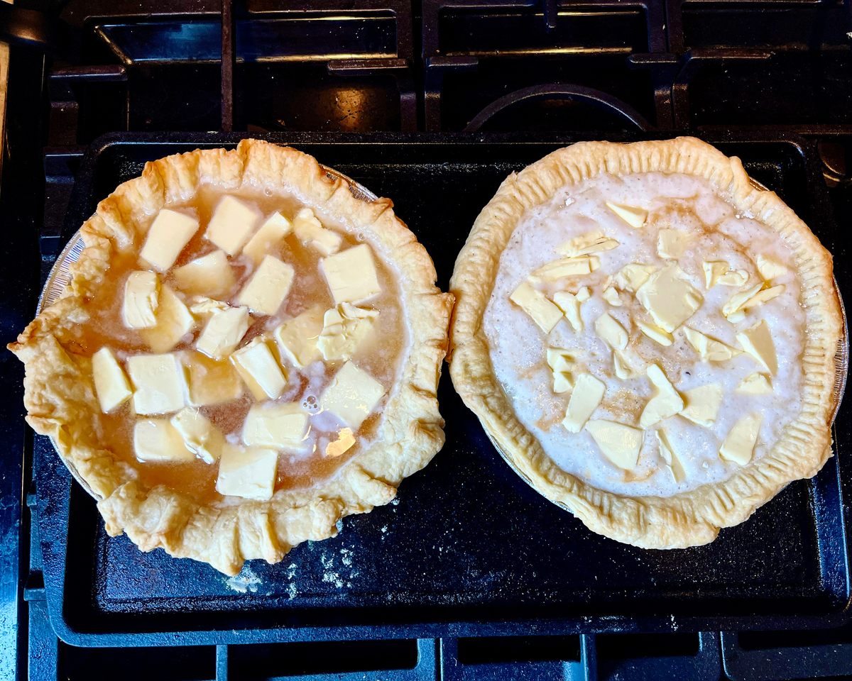 Both the water (left) and Sprite pies get liberally dotted with butter before baking.