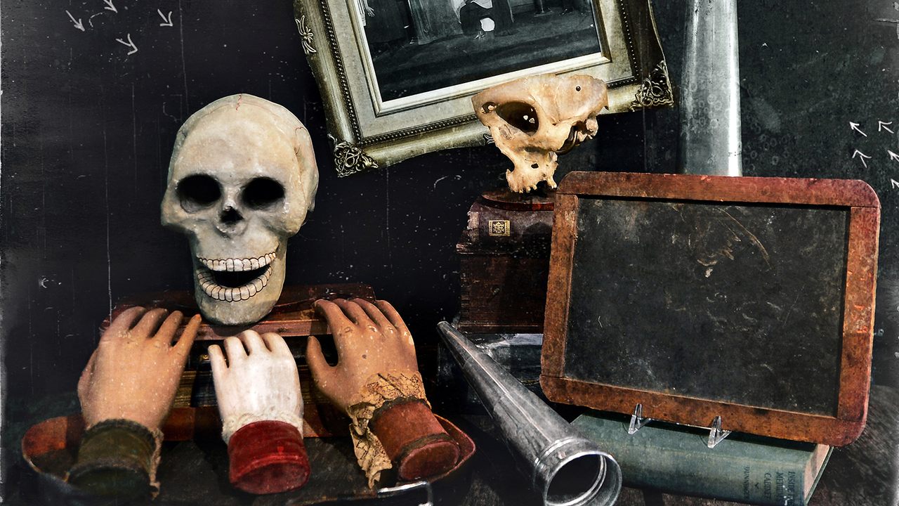 A collection of props for a medium, including a talking skull, rapping hands and a slate to record ghostly visits.   