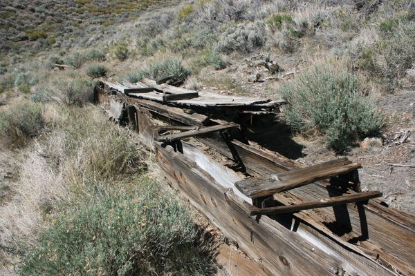 Weathered remnants of the old wooden box flume.