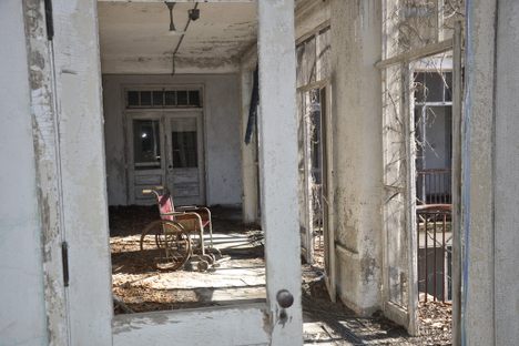 A wheelchair in the abandoned building