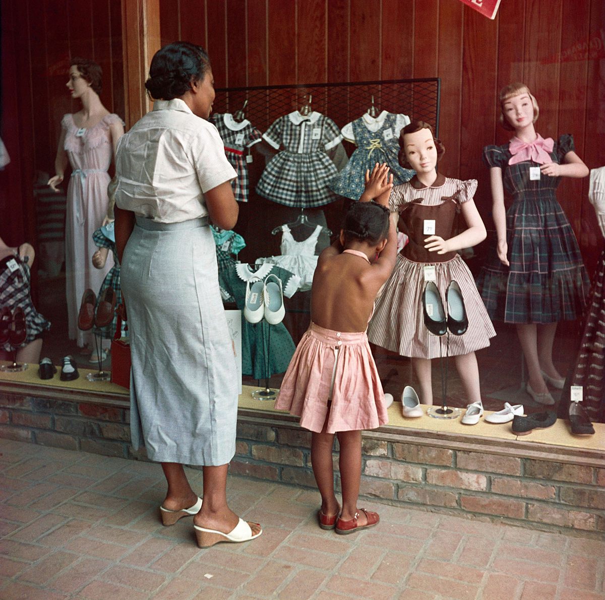 In the summer of 1956, <em>LIFE</em> magazine sent Parks to Mobile, Alabama, to photograph the everyday experiences of Black families in the segregated South. Over several weeks, Parks focused his lens on the Thorntons—Albert and his wife (whose name is not recorded), many of their nine children and 19 grandchildren, and even some of their great grandchildren. This image of young Ondria Tanner and her grandmother, Ondria Thornton, was one of 26 that appeared in the magazine that fall.
