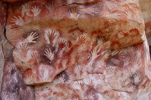 There are hundreds of stenciled handprints in the caves. 