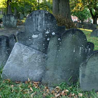 Many of the gravestones appear to be sinking into the ground