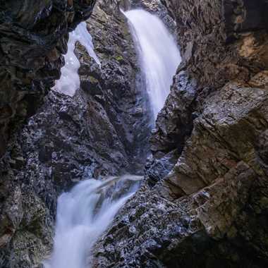 Zapata Falls in the San Luis Valley in Colorado. June 2023 photograph after relatively wet spring - some of the winter ice sheet is still present and visible in the upper left.