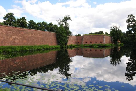 A view of the walls and moat from the main entrance.