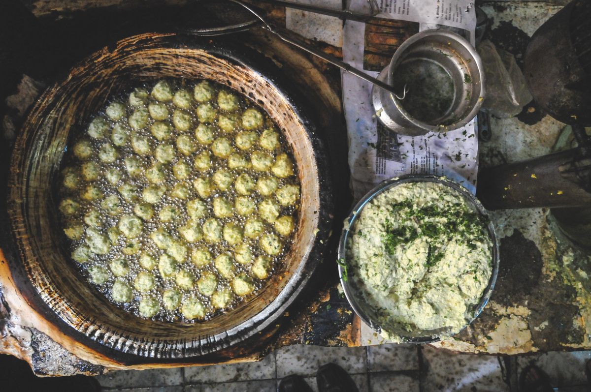 Falafel balls cooking in Cairo. Egypt is unique in not using chickpeas to make falafel.