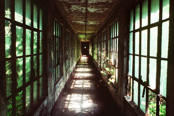 An abandoned corridor between buildings on Ellis Island. 