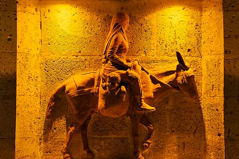 The rear panel on Çanakçı Heykeli featuring a woman on a donkey.
