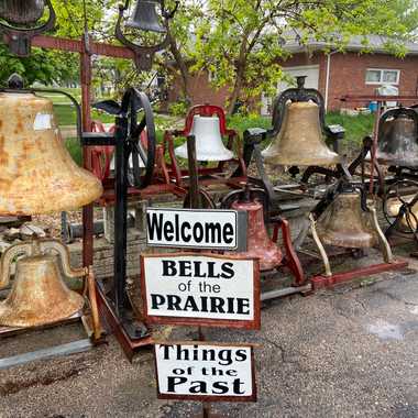 Sign and left side of the collection of bells