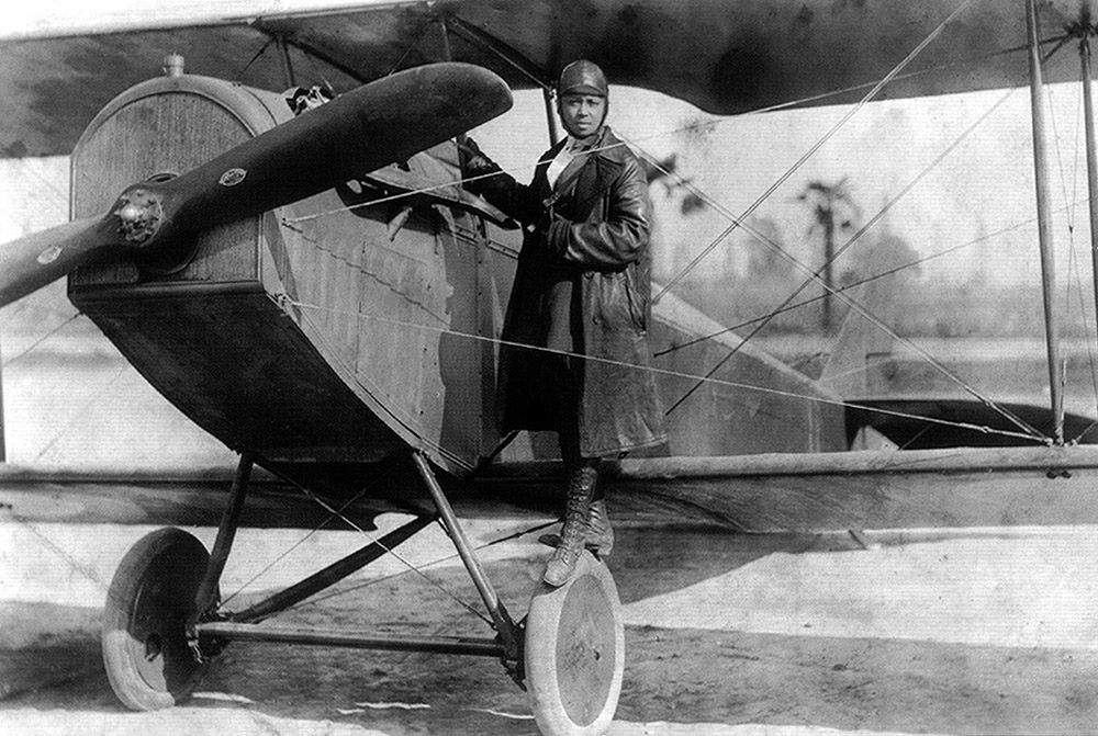 Bessie Coleman and her biplane in 1922.