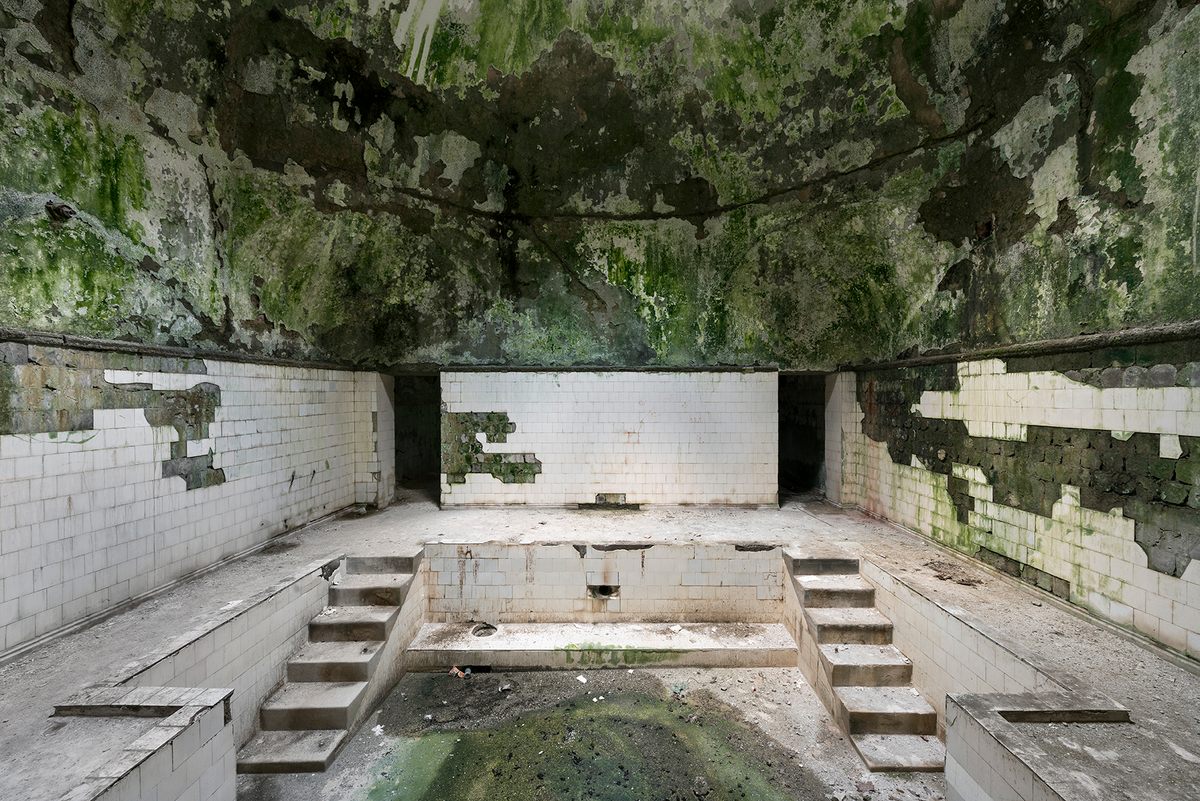 A bathhouse in Tskaltubo, Georgia. Water still flows through and under these baths, undermining the structure.