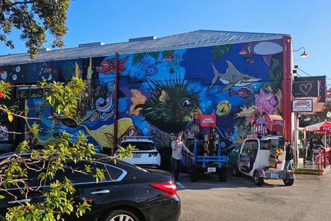 A large aquatic mural marks the entrance to Silverball Retro Arcade.