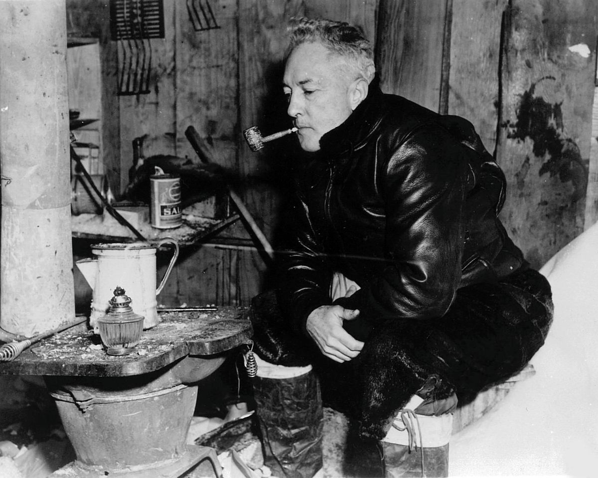 Richard Byrd in 1947, smoking a pipe left behind during his 1935 expedition.