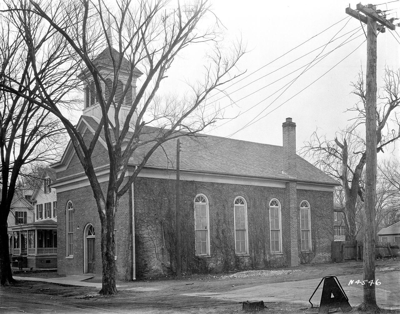 The First Baptist Church was torn down in 1957 and replaced by a parking lot.