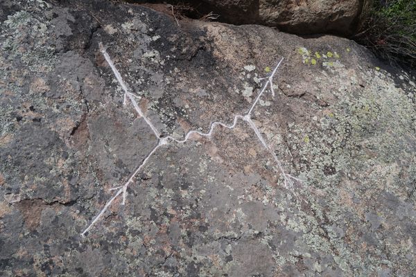 Feynman Diagram rock carving.