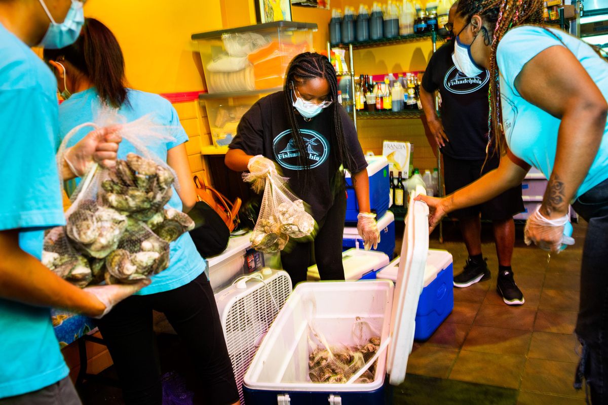 At a community kitchen in Philadelphia, high school students pack up oysters for a weekly delivery