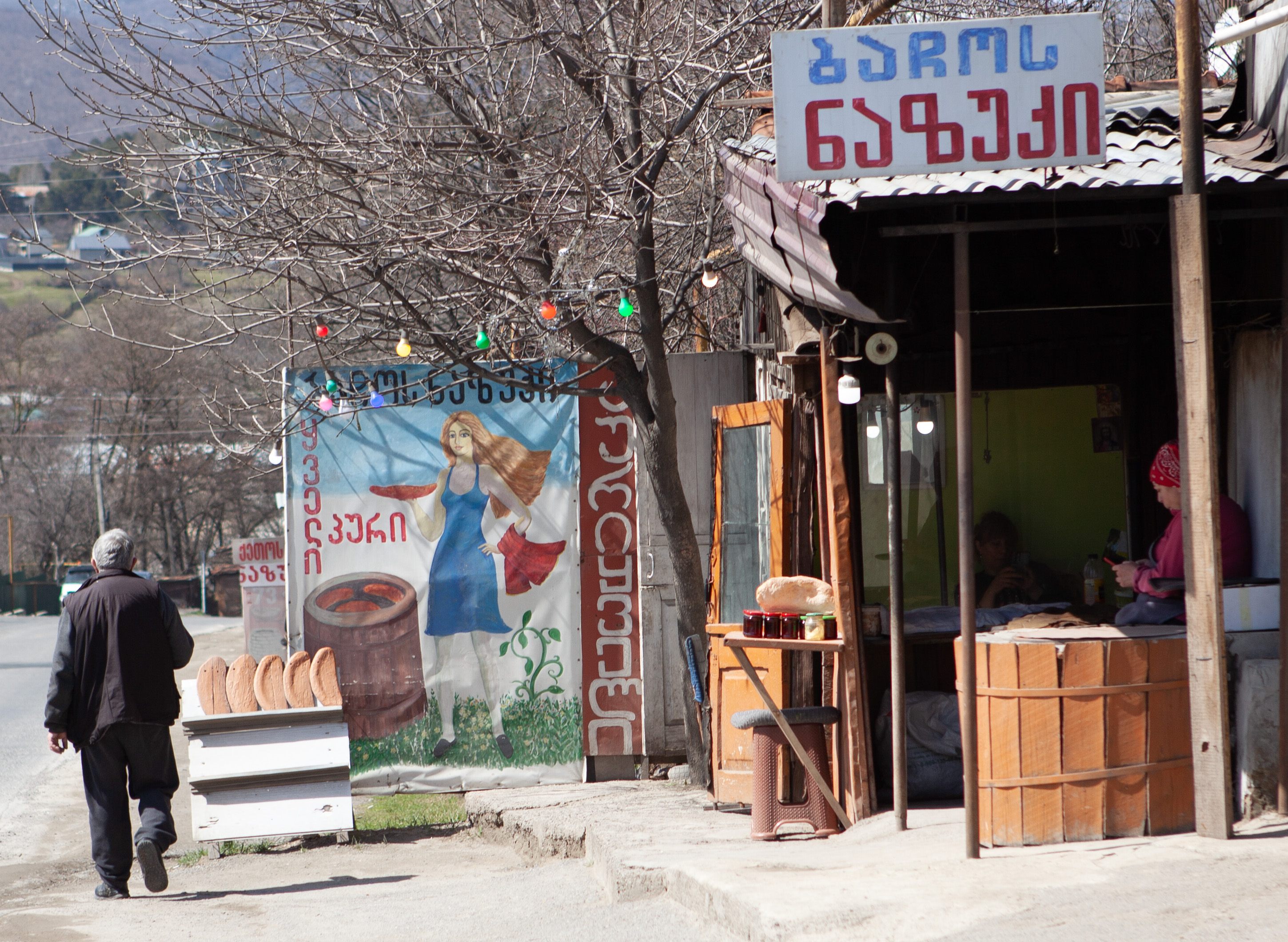 Colorful signage distinguishes each vendor's stall.