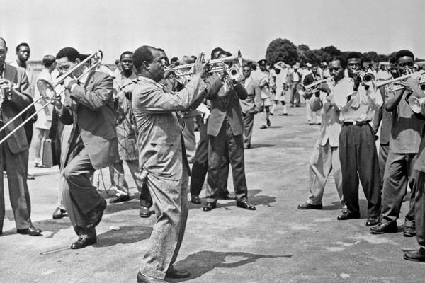 Louis Armstrong and his band perform for a crowd of some 40,000 gathered to greet him at the airport in Accra, Ghana, in the spring of 1956.