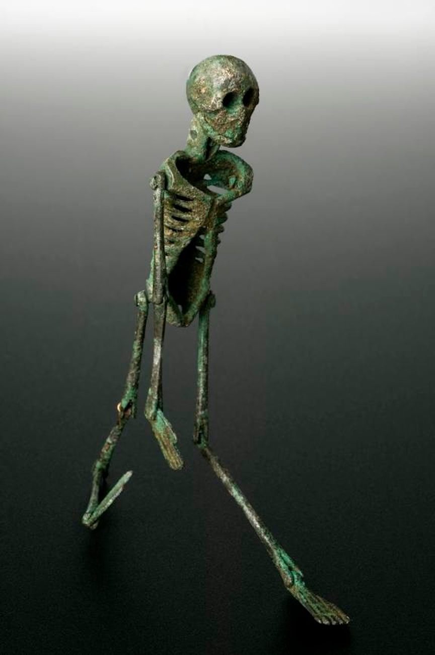 In <em>The Satyricon</em>, Trimalchio plays with a dancing skeleton like this one (c. 199 BC–500 AD) during his banquet.
