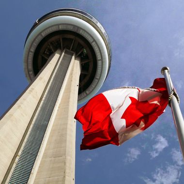 CN Tower with the Canadian flag