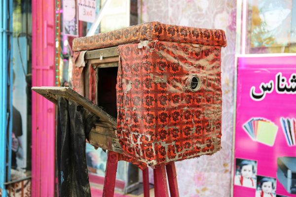 The Afghan box camera—kamra-e-faoree ("instant camera") in Dari—is housed in a brightly colored box to attract passersby.