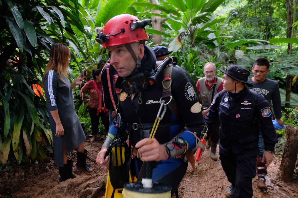 British cave diver Rick Stanton walking past reporters outside Tham Luang cave in the early days of the rescue operation.