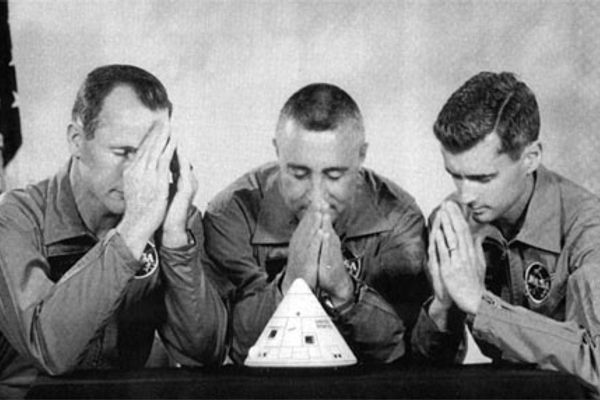 The Apollo 1 crew jokingly showing their faith in the craft.