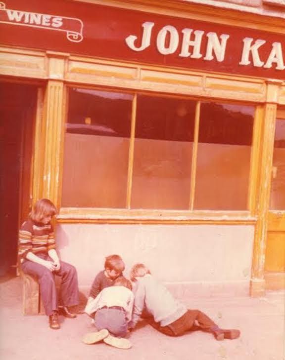 Anne, Anthony, Ciarán, and Eoin play in front of the pub sometime in the late 1970s.