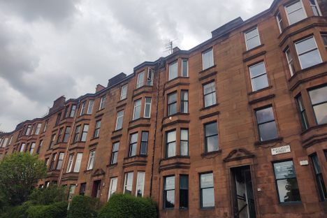 The House is almost undistinguishable in this row of typical Glasgow tenements.