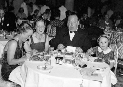 Alfred Hitchcock with his family and screenwriter Joan Harrison.