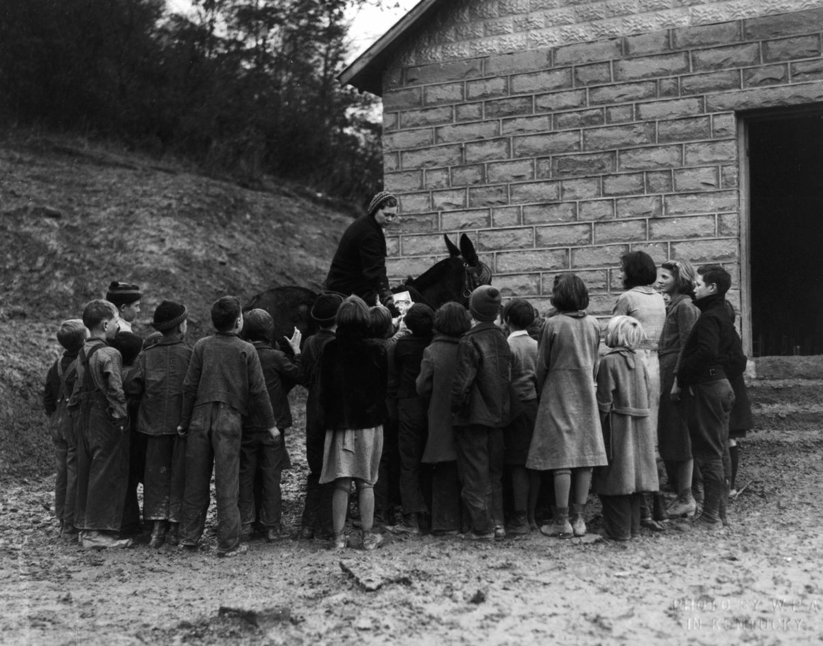 Children greet the "book woman," 1940.