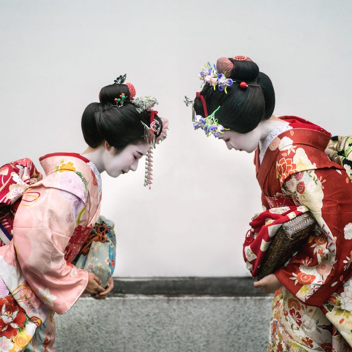 Geishas greeting each other 