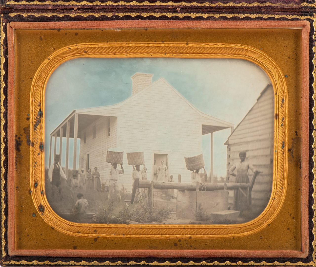 The daguerreotype within its original leather frame.
