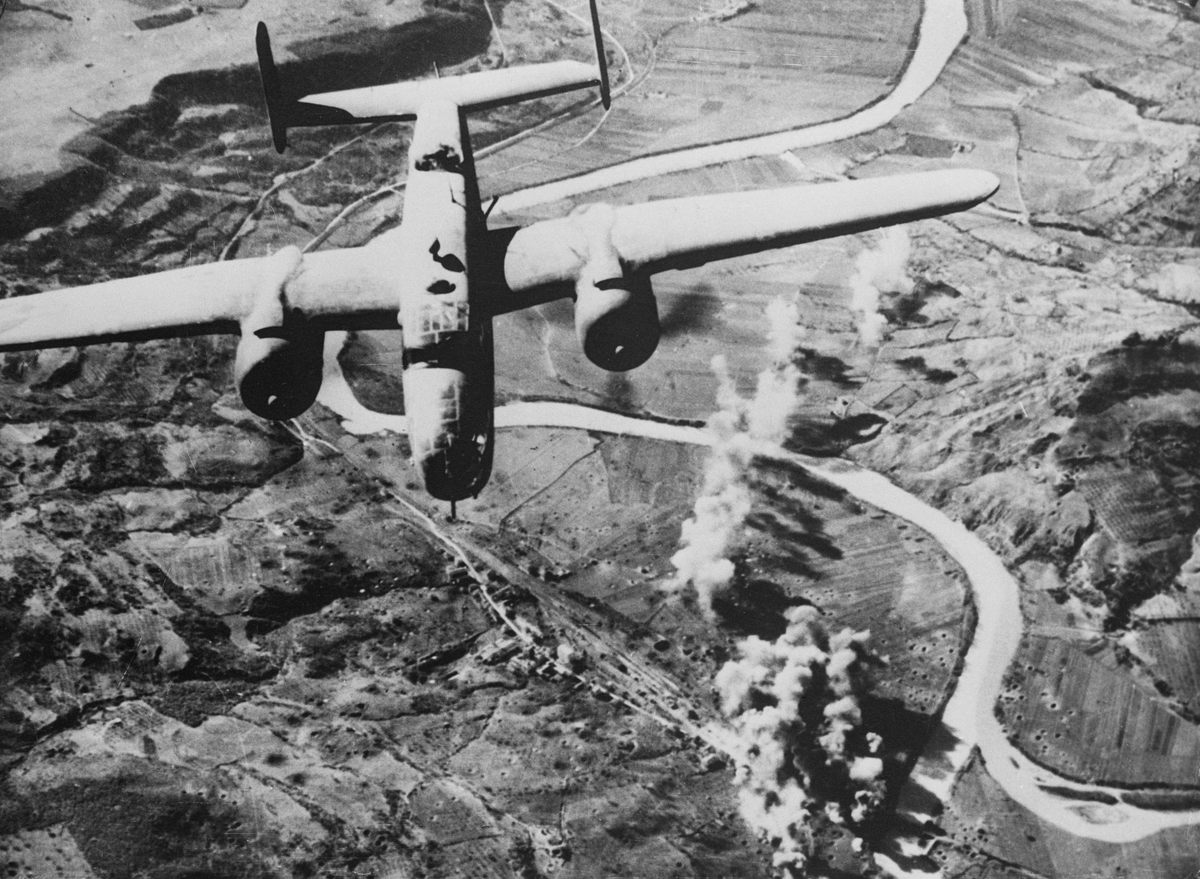 An American Mitchell B-25 bombs the rail yards at Orte, Italy, to disrupt German communications in 1944.