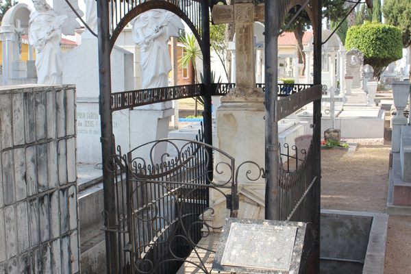 The tomb of a man named Santiago Flores, made of wrought iron.