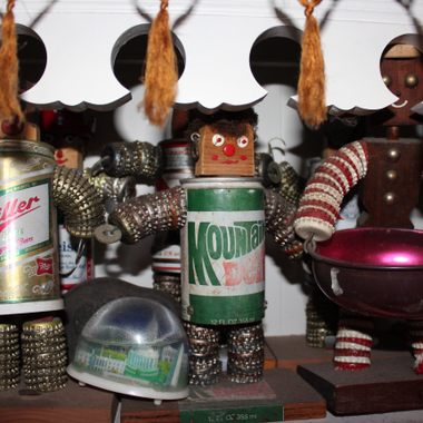 Bottlecap people lining the shelves on Walker's kitchen. 