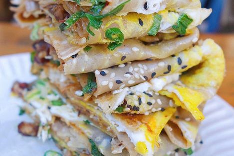 Eggs, hoisin sauce, chili, cilantro, sesame, crunchy wontons, and peking duck.