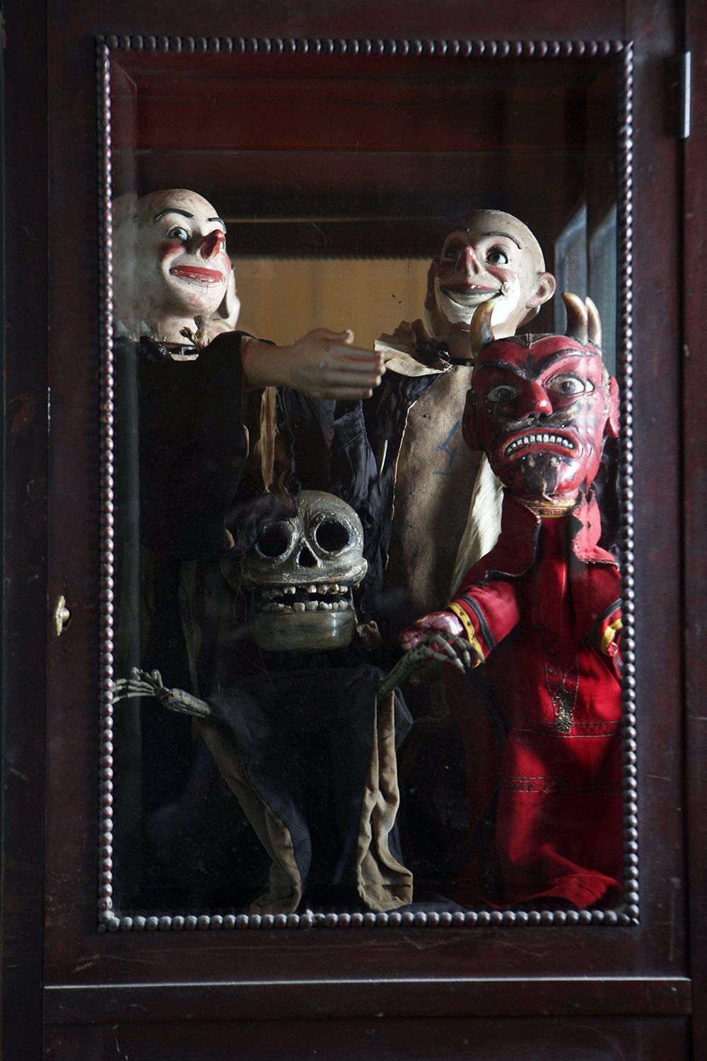 Antique puppets and automatons. The skeleton has real human teeth and the devil sports real animal horns.